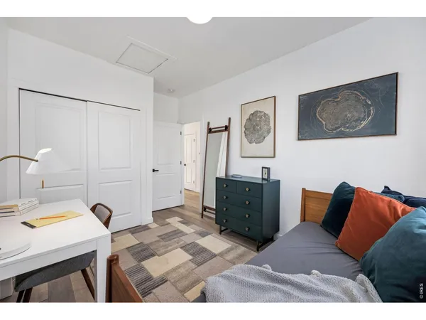 a bedroom with a bed and a cabinets