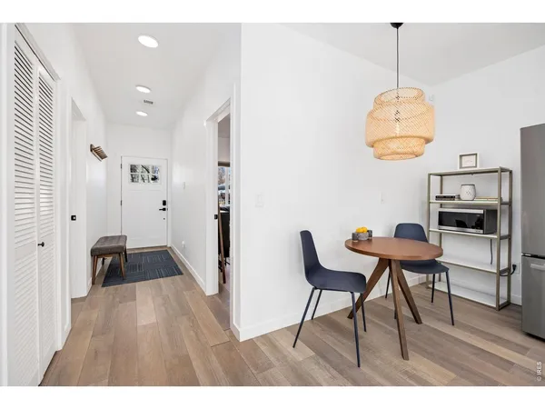 a dining room with furniture and window