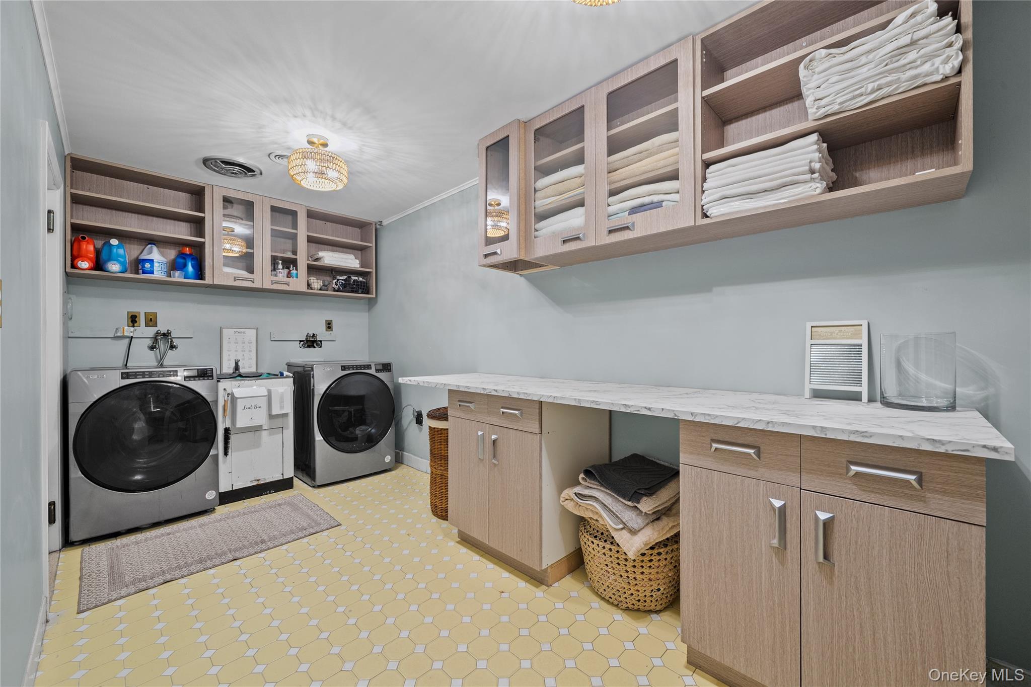 55 Rolling Hill Lane Old Westbury, NY 11568 - Photo 31 of 48 Washroom with cabinet space and washer and dryer