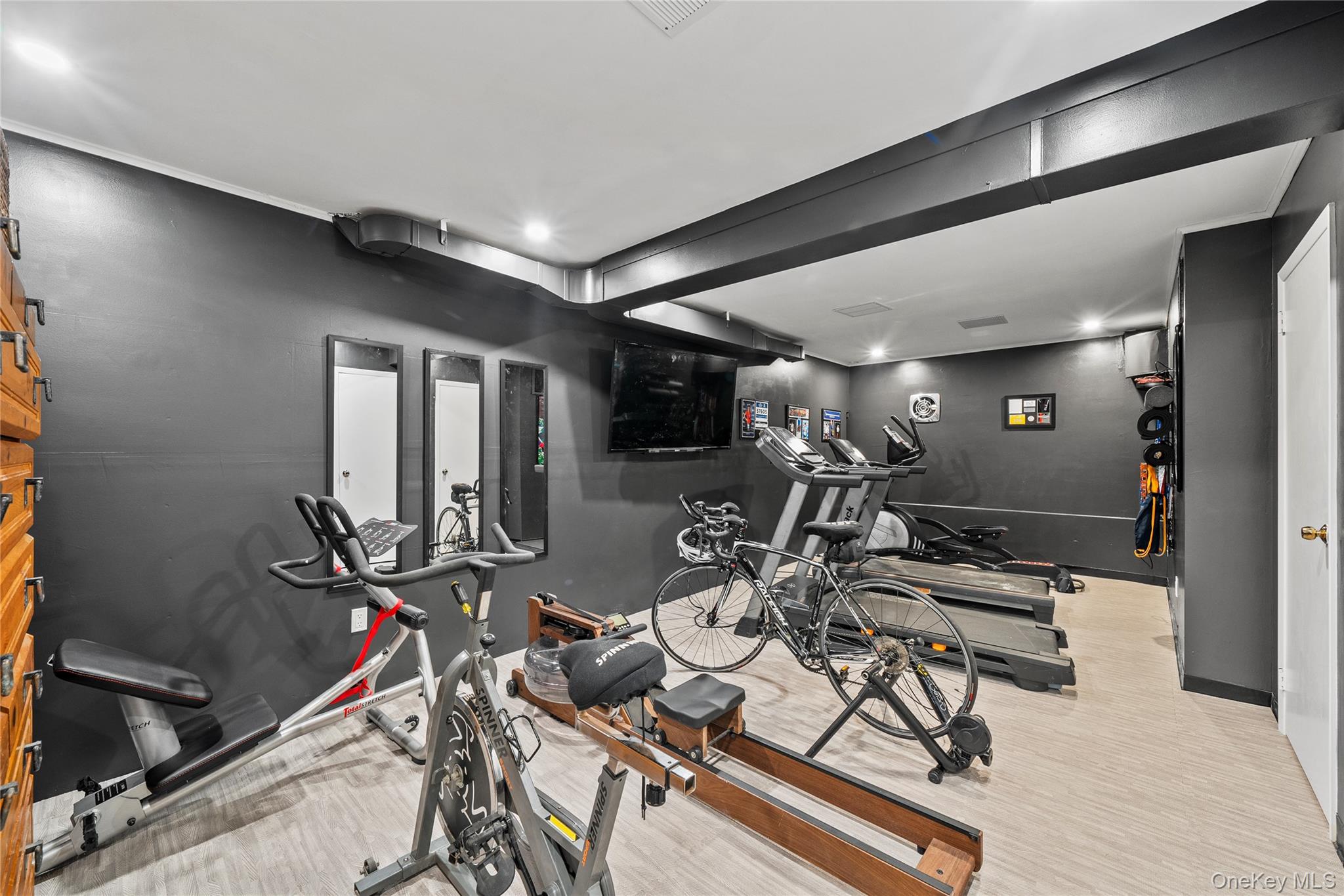 55 Rolling Hill Lane Old Westbury, NY 11568 - Photo 32 of 48 Workout area featuring wood finished floors