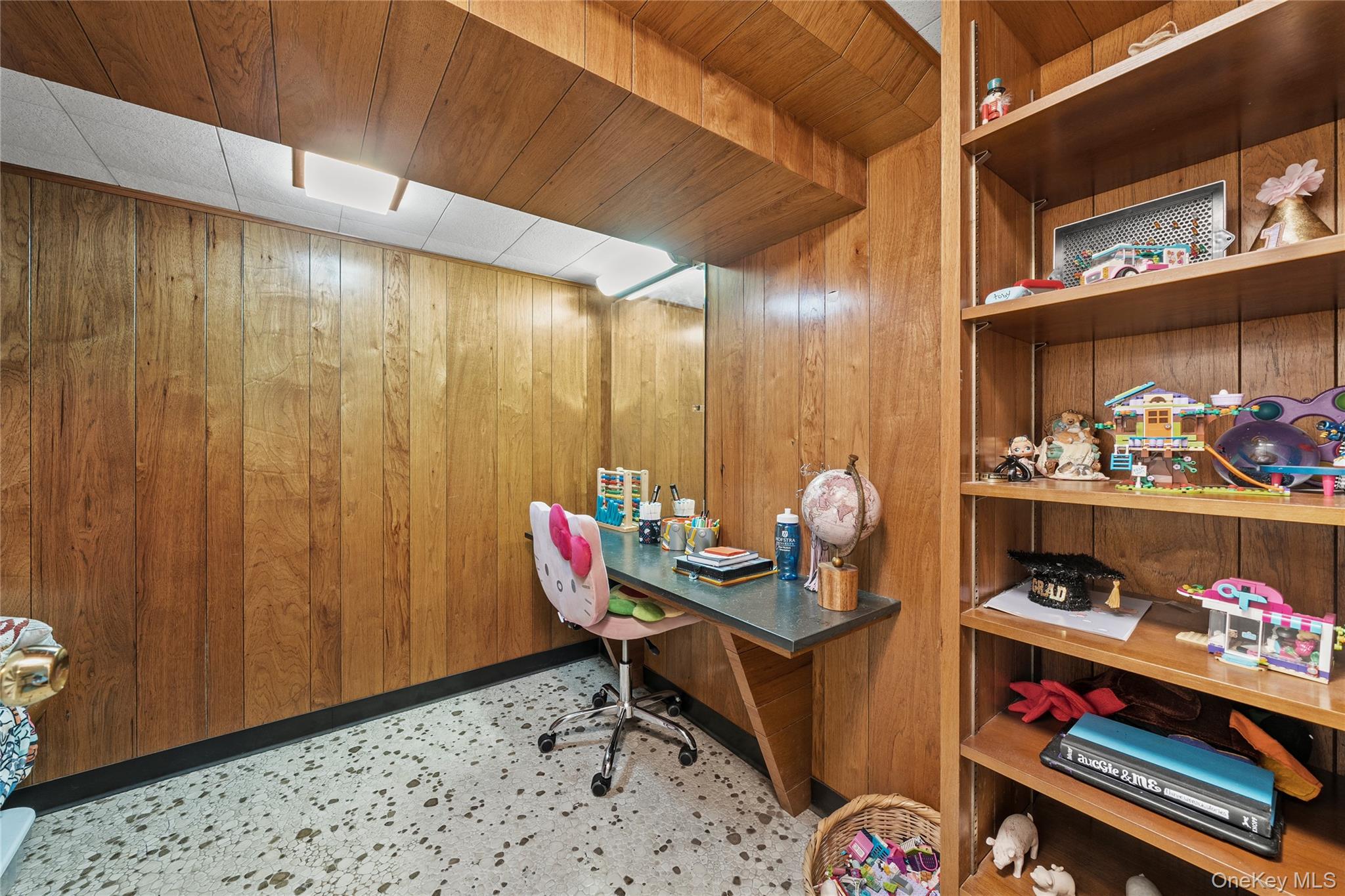 55 Rolling Hill Lane Old Westbury, NY 11568 - Photo 36 of 48 Office area with wood walls, wood ceiling, and dark aggregate flooring