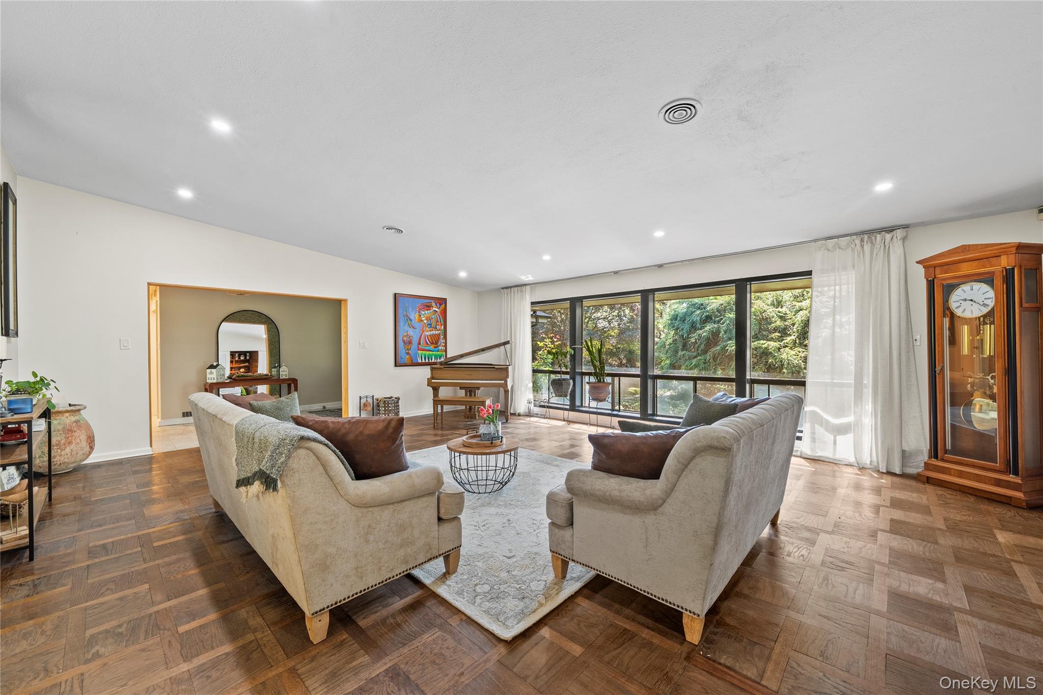 55 Rolling Hill Lane Old Westbury, NY 11568 - Photo 5 of 48 Living area with lofted ceiling and recessed lighting