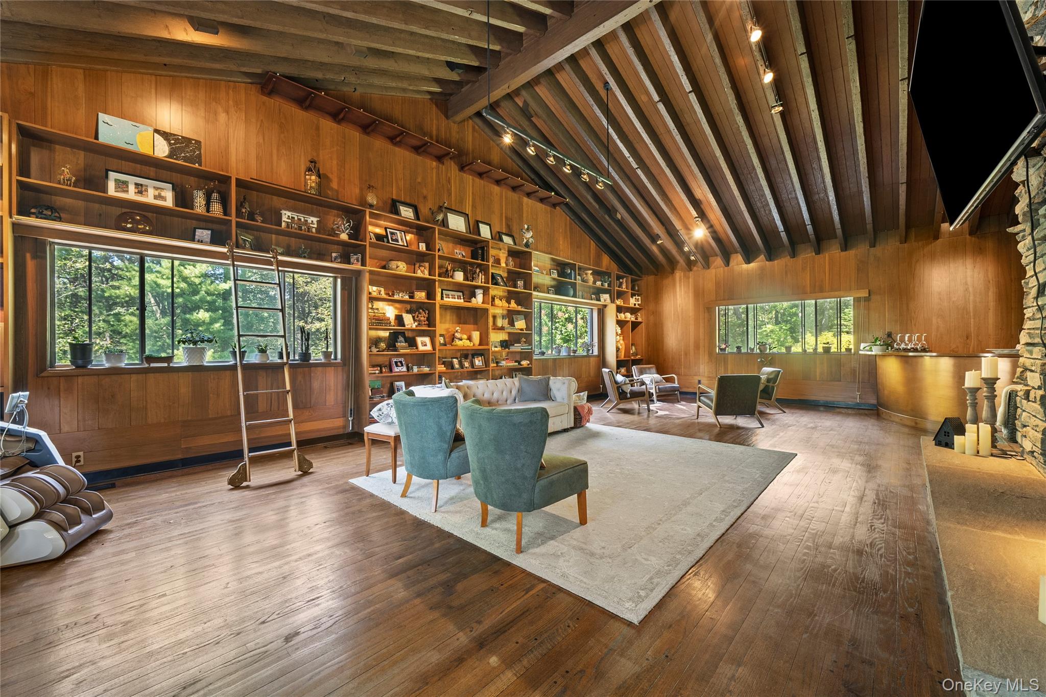 55 Rolling Hill Lane Old Westbury, NY 11568 - Photo 10 of 48 Living room featuring wooden walls, beamed ceiling, hardwood / wood-style floors, and high vaulted ceiling