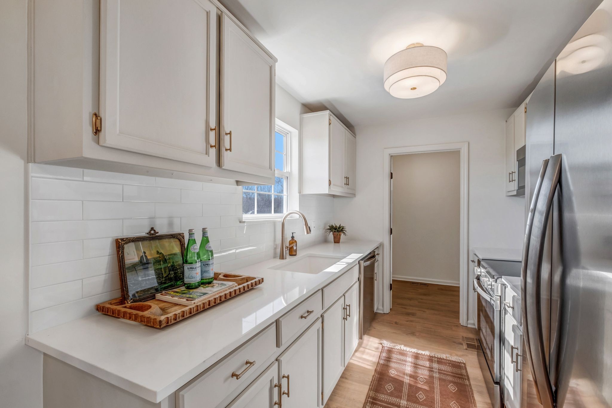 2308 Rogers Lane Lebanon, TN 37087 - Photo 15 of 36 a kitchen with stainless steel appliances granite countertop a refrigerator a stove and white cabinets