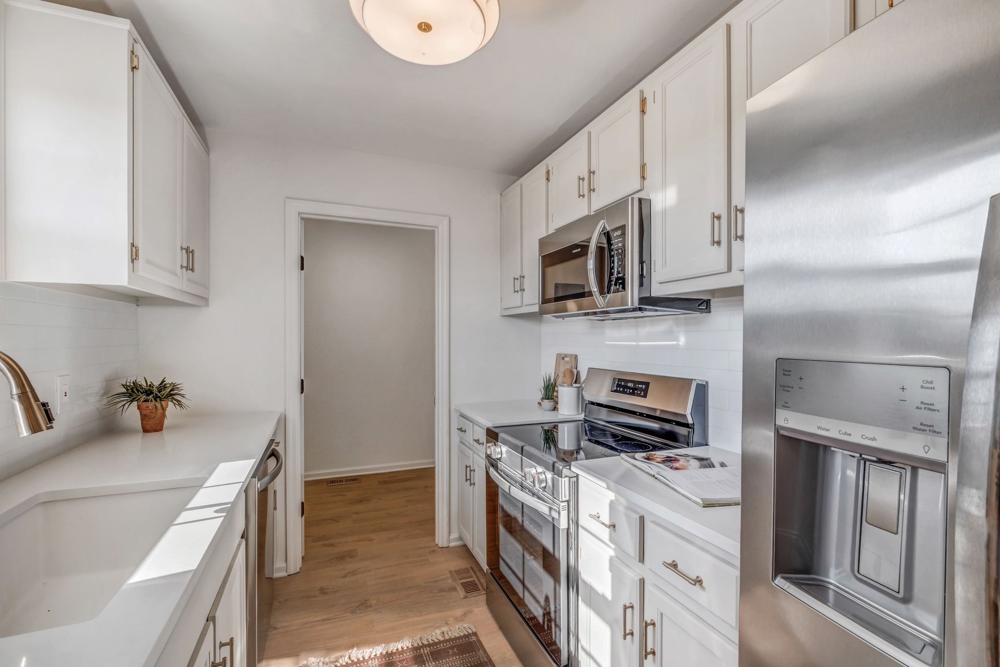 2308 Rogers Lane Lebanon, TN 37087 - Photo 16 of 36 a kitchen with stainless steel appliances a stove microwave and refrigerator