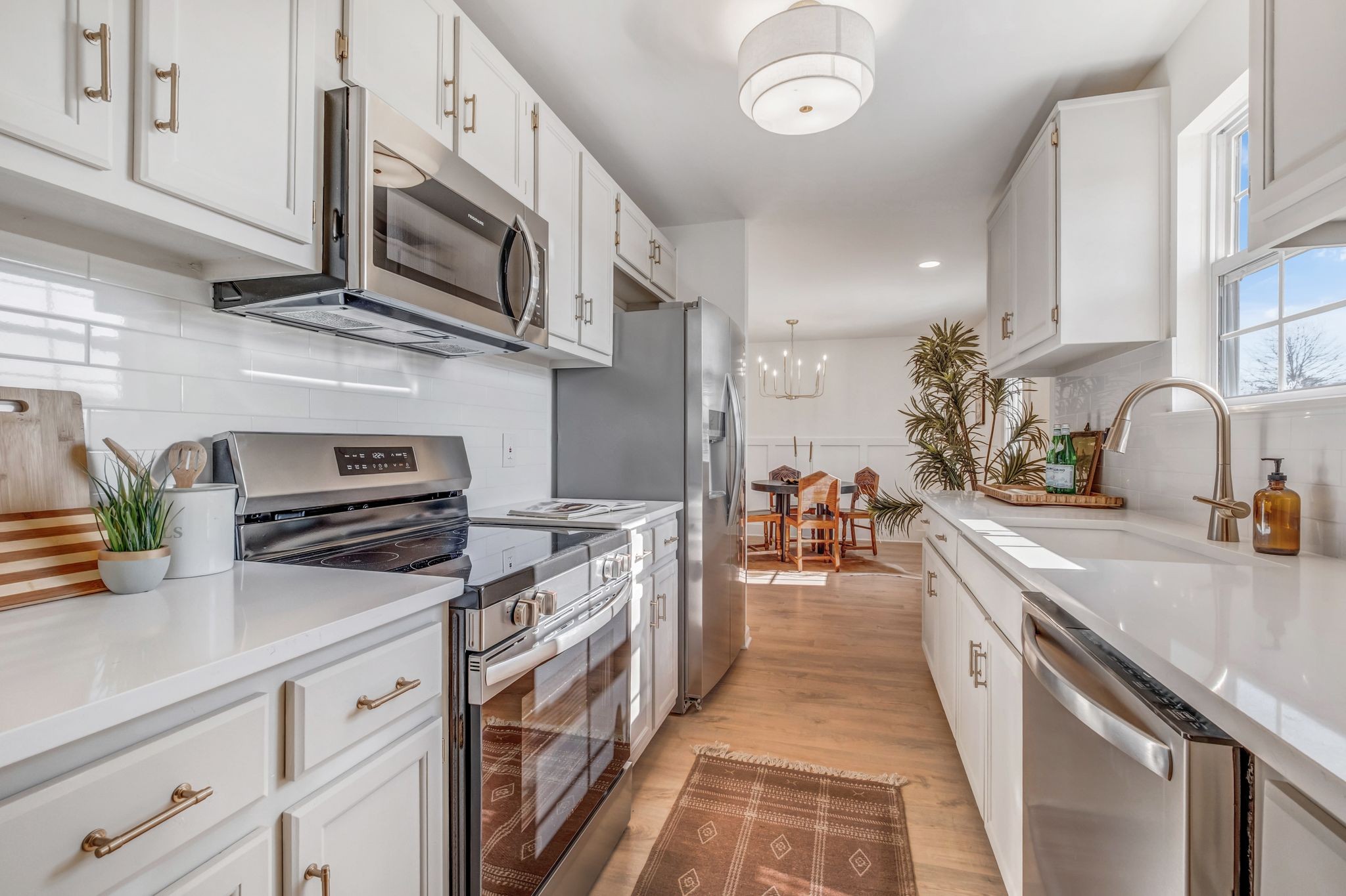 2308 Rogers Lane Lebanon, TN 37087 - Photo 17 of 36 a kitchen with stainless steel appliances granite countertop a sink stove and cabinets
