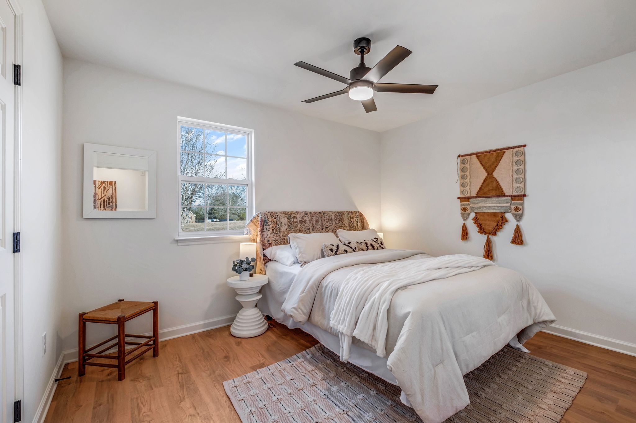 2308 Rogers Lane Lebanon, TN 37087 - Photo 24 of 36 a bedroom with a bed and wooden floor