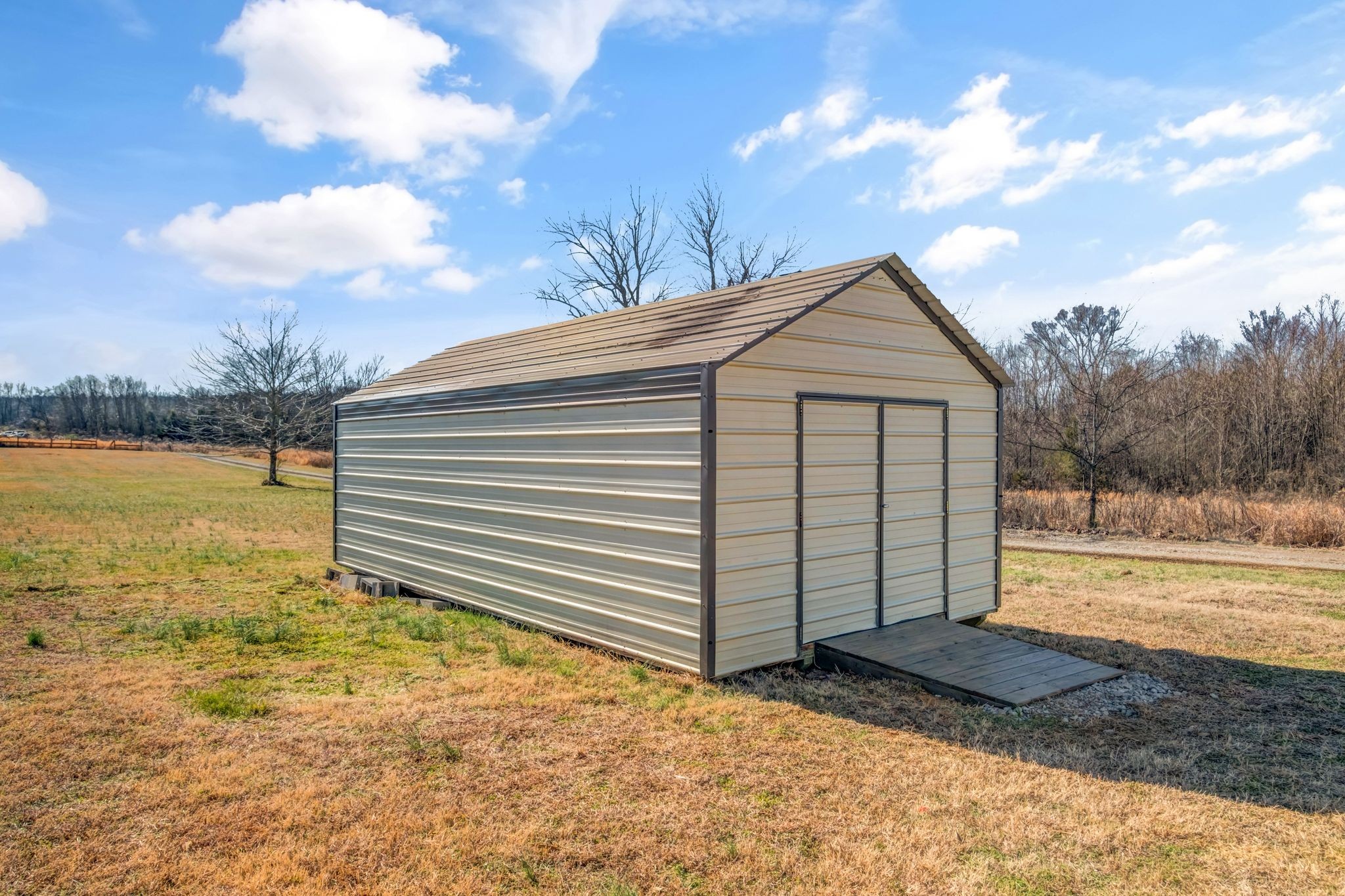 2308 Rogers Lane Lebanon, TN 37087 - Photo 32 of 36 a view of a house with a yard and wooden fence