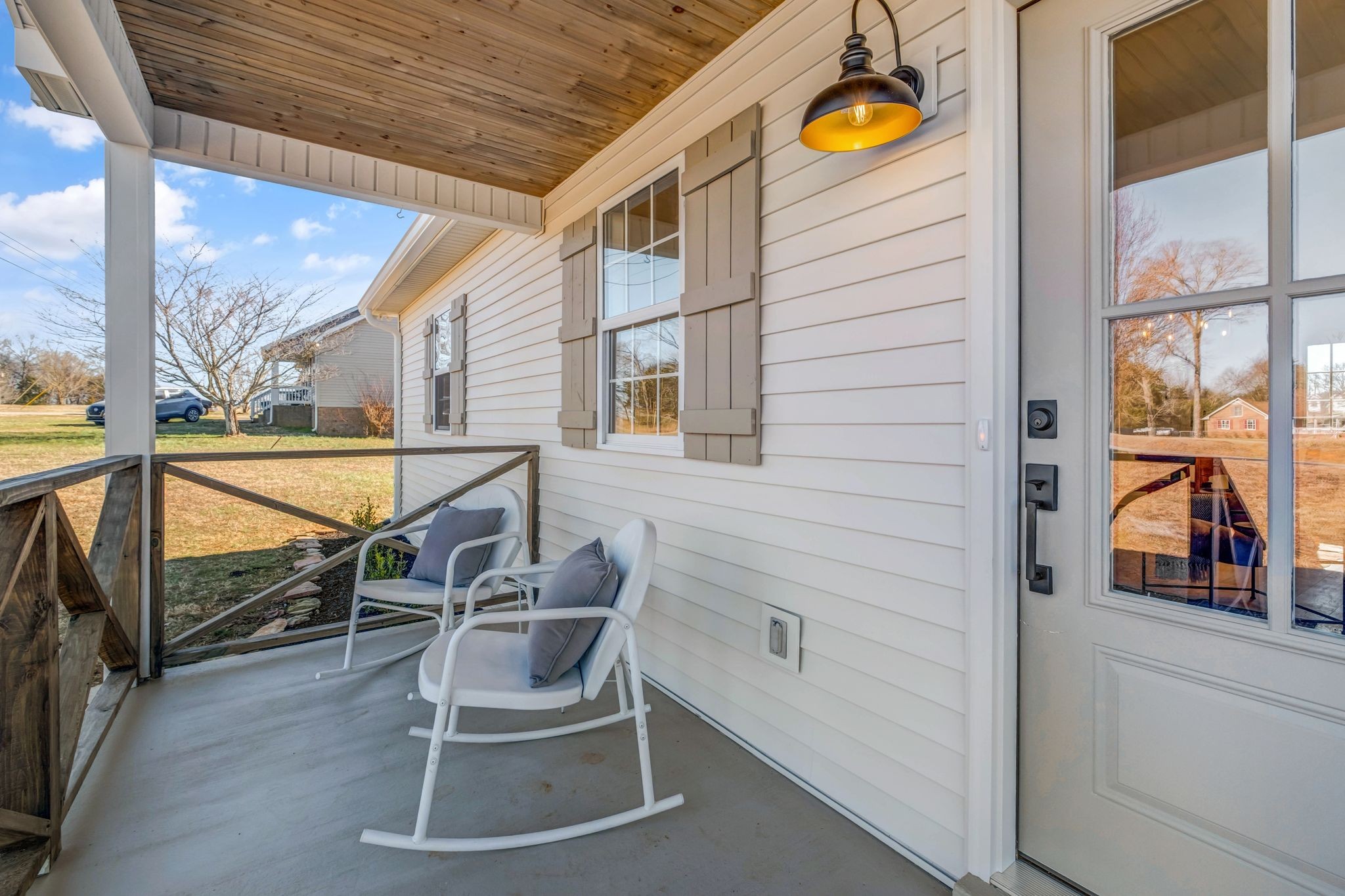 2308 Rogers Lane Lebanon, TN 37087 - Photo 7 of 36 a balcony with couple of chairs and wooden fence