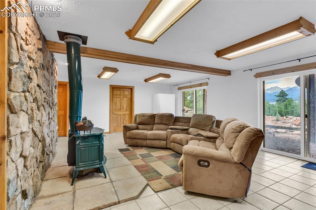 209 Rosewood Road Westcliffe, CO 81252 - Photo 31 of 49 Multiple walkouts from the den to the back yard. Enjoy the mountain views, even from the basement!