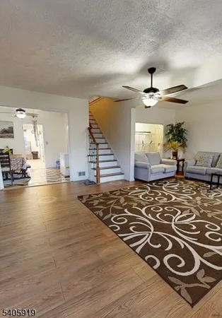 a view of kitchen and dining room with wooden floor