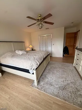 a bedroom with a bed and a mirror