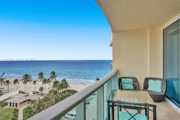 a view of a balcony with chairs