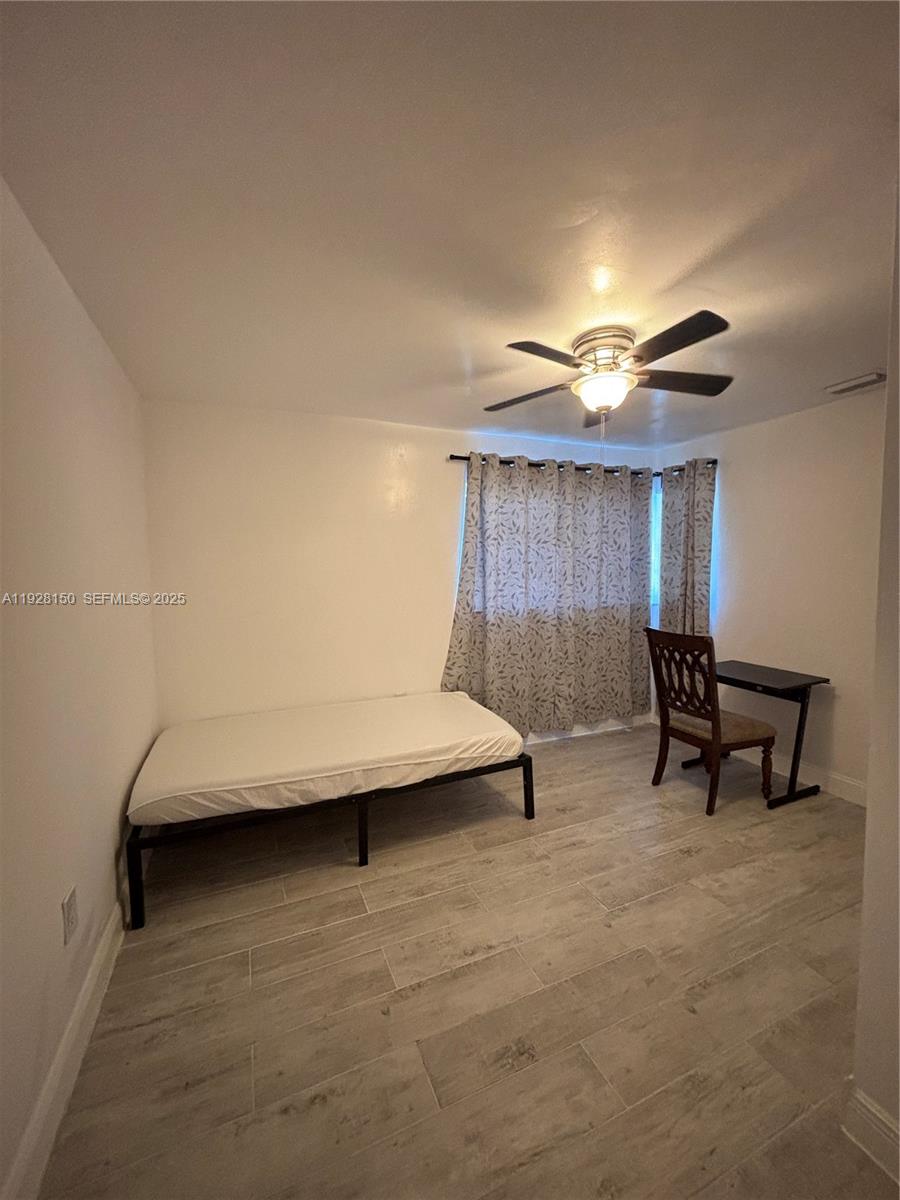 4807 Ponce De Leon, Unit 1 Coral Gables, FL 33146 - Photo 5 of 8 a view of livingroom with furniture and chandelier fan