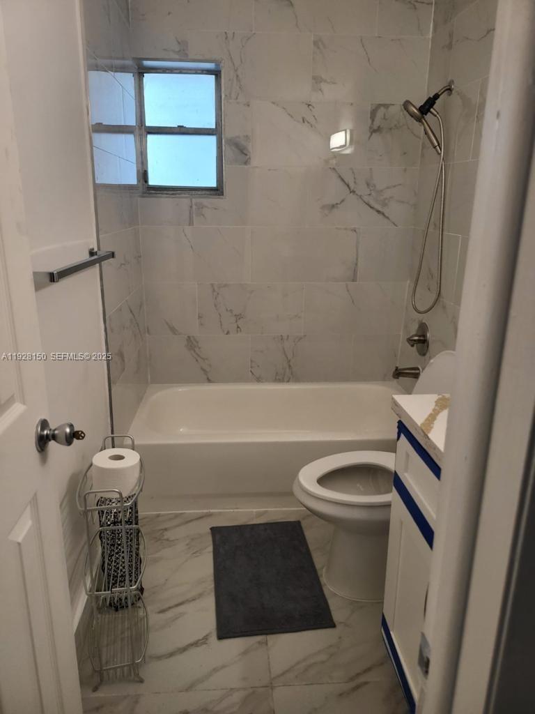 4807 Ponce De Leon, Unit 1 Coral Gables, FL 33146 - Photo 6 of 8 a bathroom with a bathtub and shower