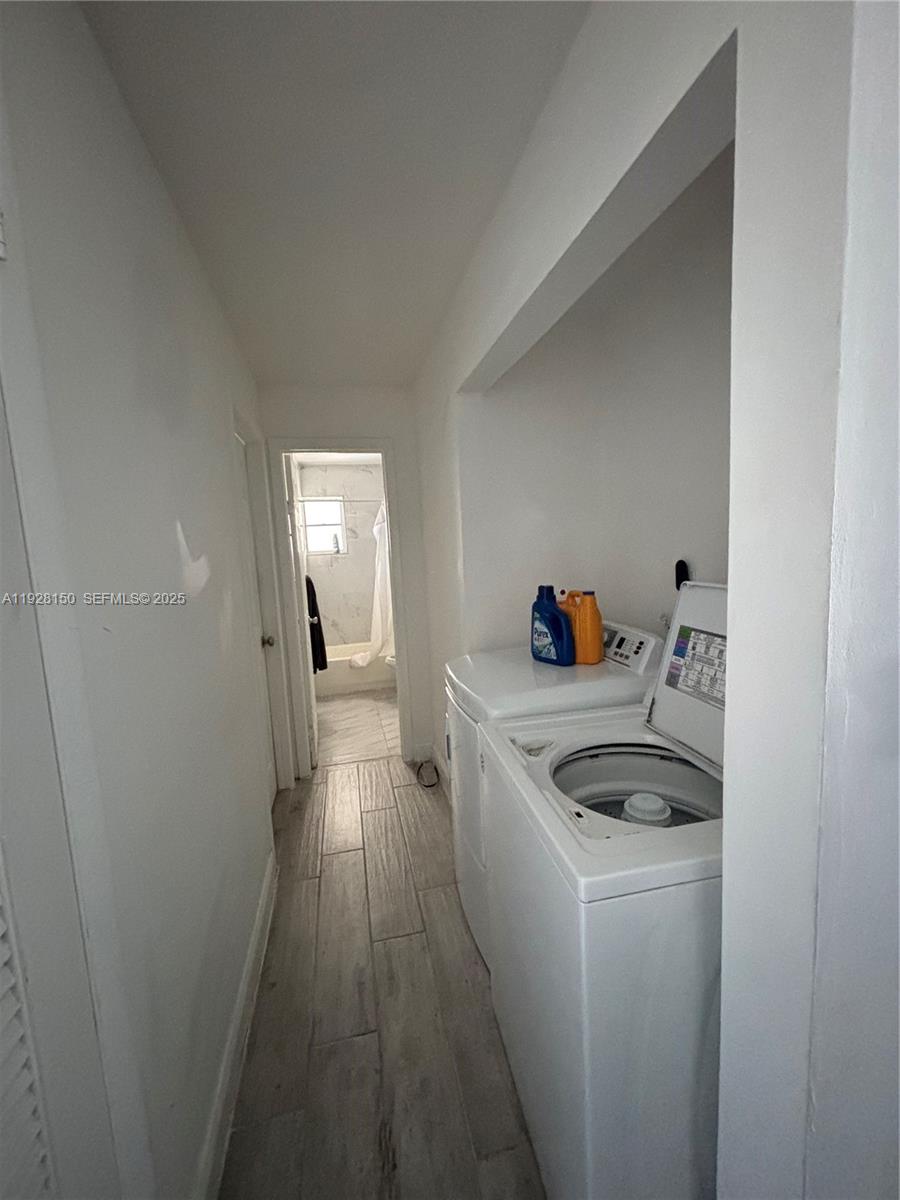 4807 Ponce De Leon, Unit 1 Coral Gables, FL 33146 - Photo 8 of 8 a kitchen with a sink and wooden floor