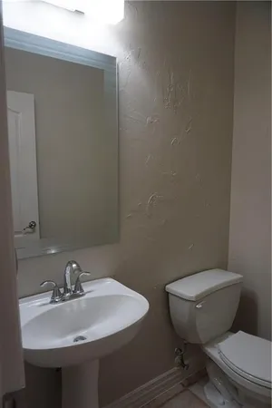 a bathroom with a sink and a toilet