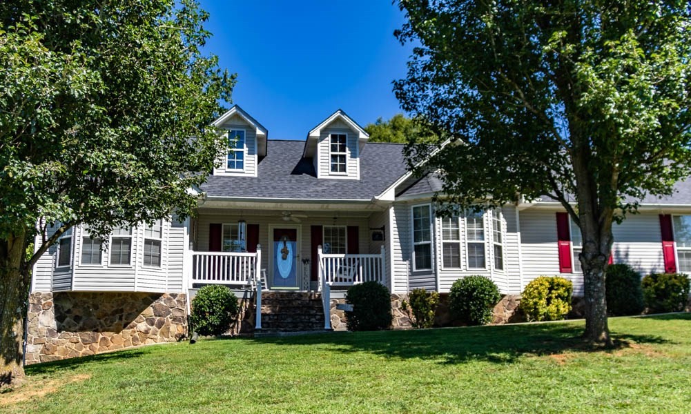 225 Robbies Lane Decatur, TN 37322 - Photo 2 of 43 a front view of a house with a yard