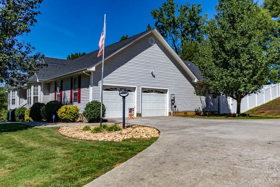 225 Robbies Lane Decatur, TN 37322 - Photo 5 of 43 a front view of a house with a yard
