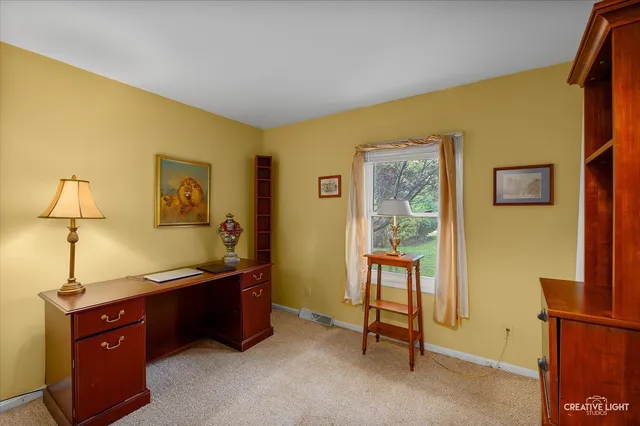 a bedroom with a bed and a table in it