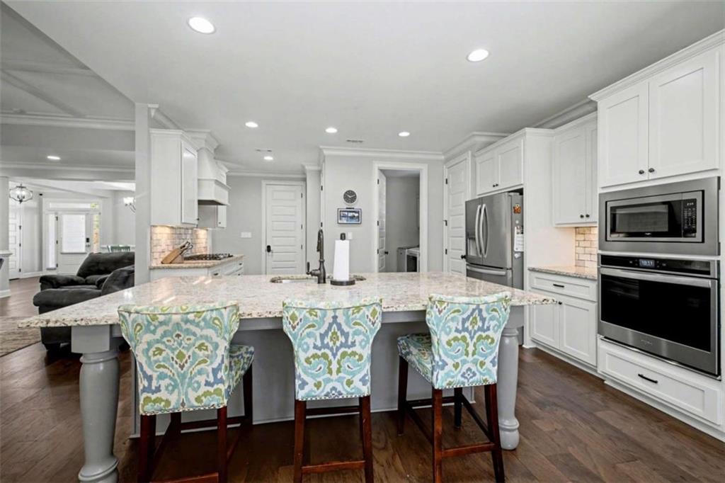 92 Gordon Oaks Way Moreland, GA 30259 - Photo 13 of 54 a large kitchen with a table and chairs