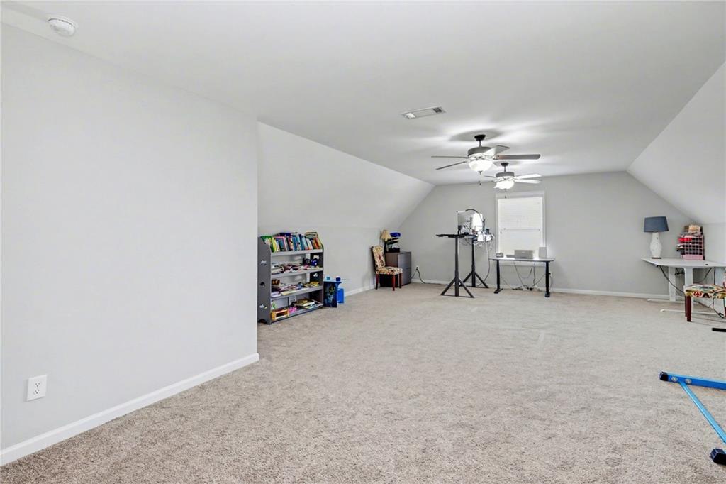 92 Gordon Oaks Way Moreland, GA 30259 - Photo 31 of 54 an empty room with furniture and chandelier