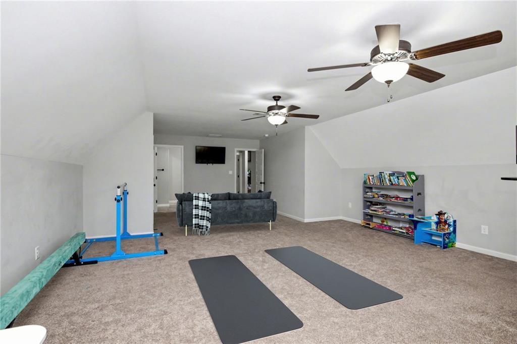 92 Gordon Oaks Way Moreland, GA 30259 - Photo 33 of 54 a living room with furniture and a chandelier