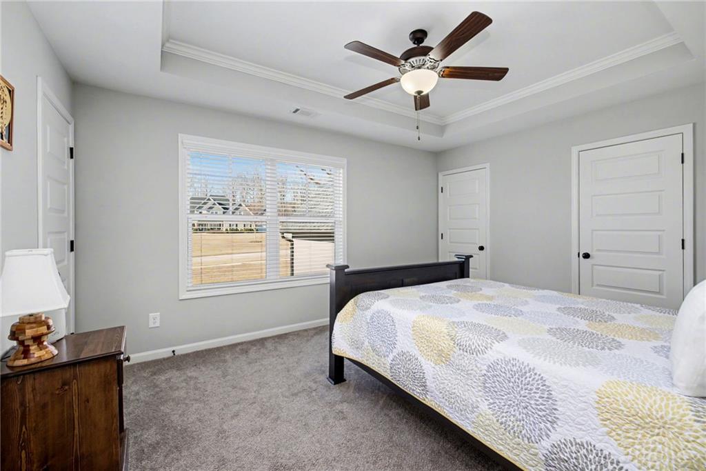 92 Gordon Oaks Way Moreland, GA 30259 - Photo 35 of 54 a bedroom with a bed and a window