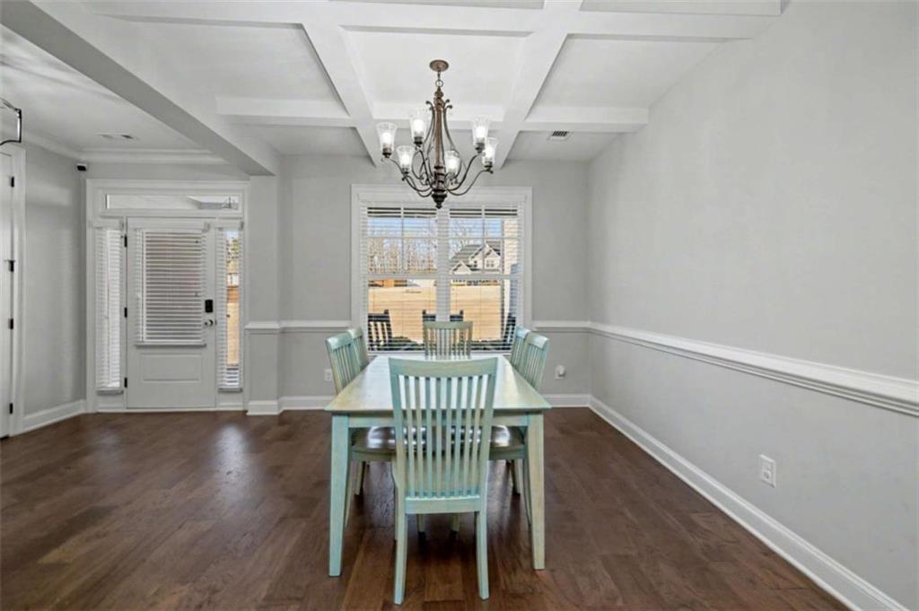 92 Gordon Oaks Way Moreland, GA 30259 - Photo 6 of 54 a view of a dining room with furniture wooden floor and chandelier