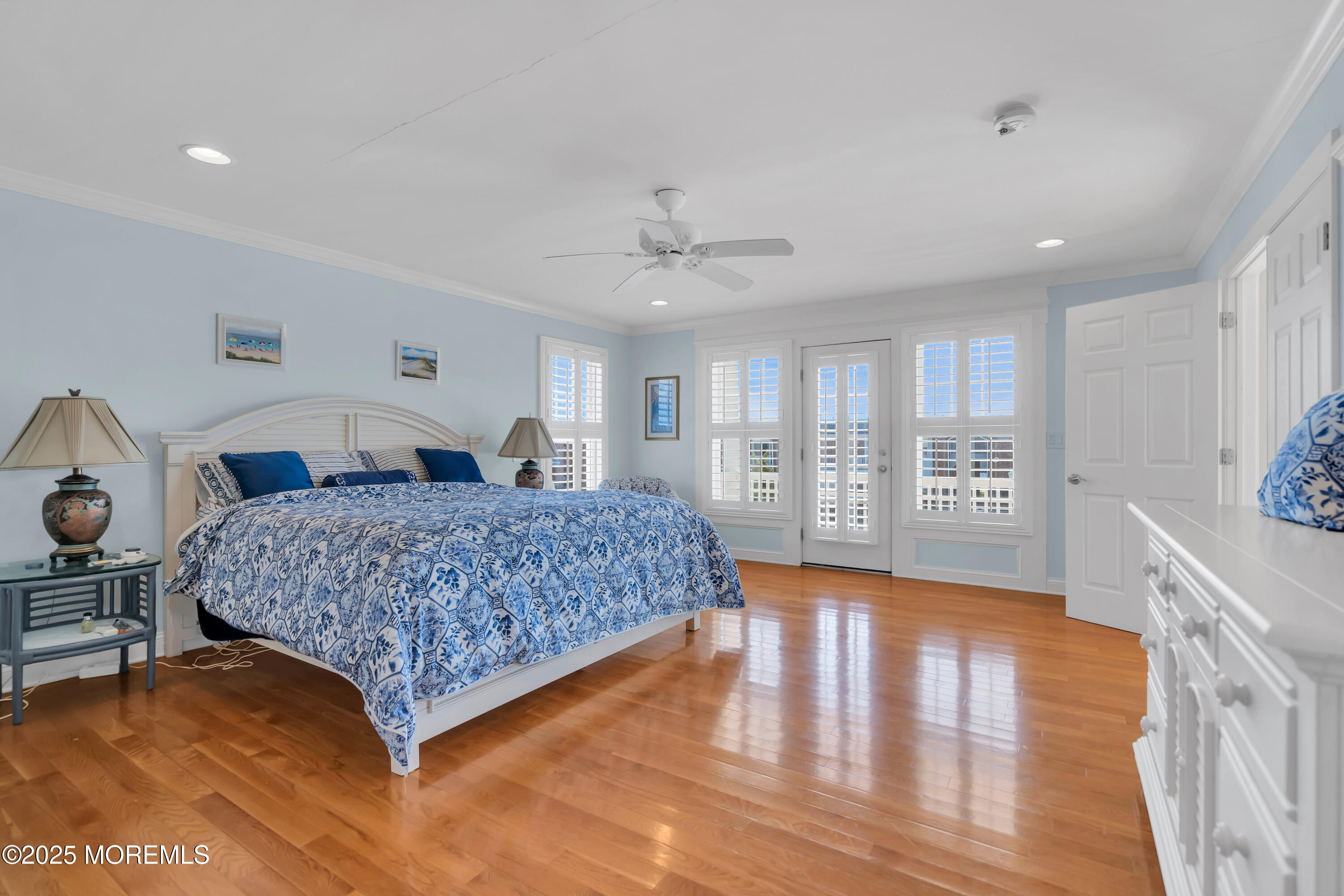 106 2nd Avenue Belmar, NJ 07719 - Photo 20 of 42 a bedroom with a large bed and wooden floor