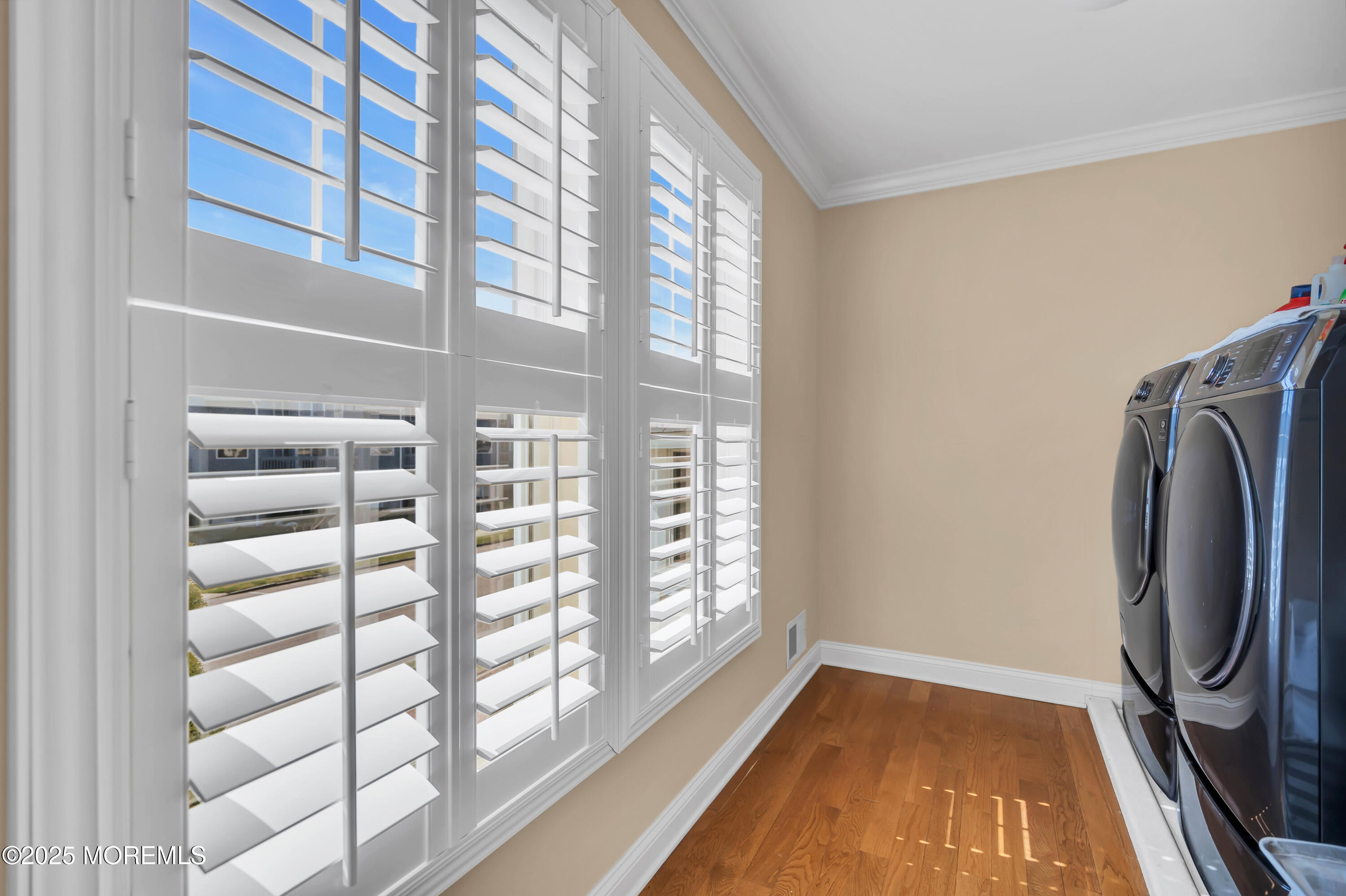 106 2nd Avenue Belmar, NJ 07719 - Photo 23 of 42 a view of a livingroom with a large window and wooden floor