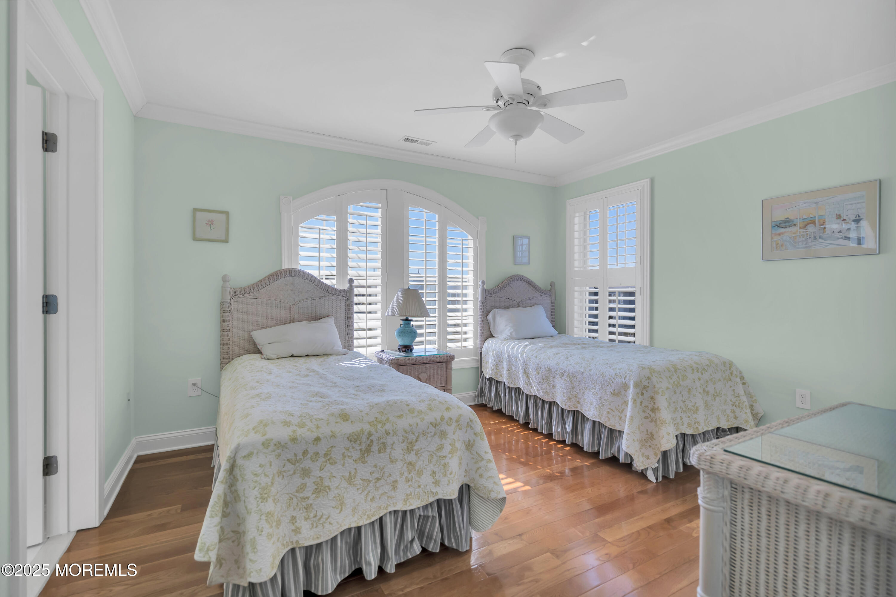 106 2nd Avenue Belmar, NJ 07719 - Photo 31 of 42 a bedroom with two beds and a chandelier