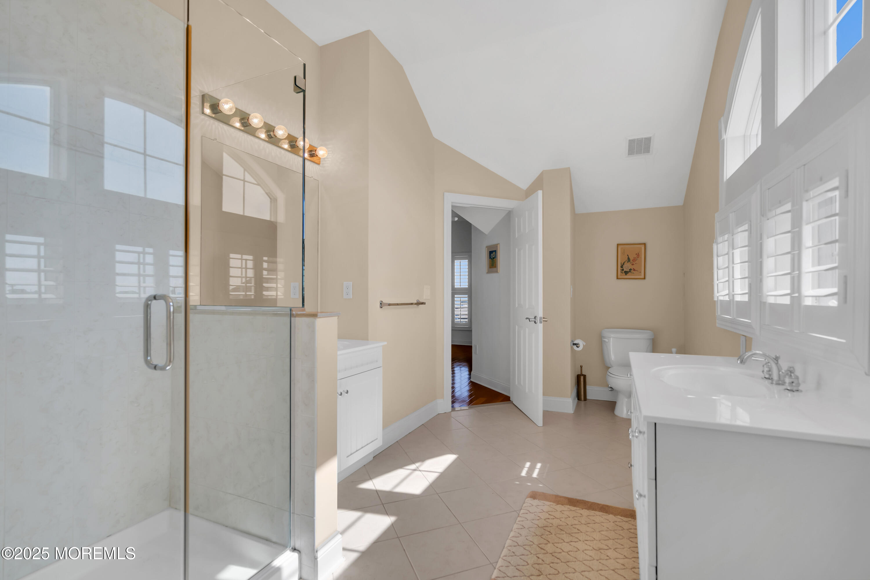 106 2nd Avenue Belmar, NJ 07719 - Photo 32 of 42 a bathroom with a sink a mirror and a shower