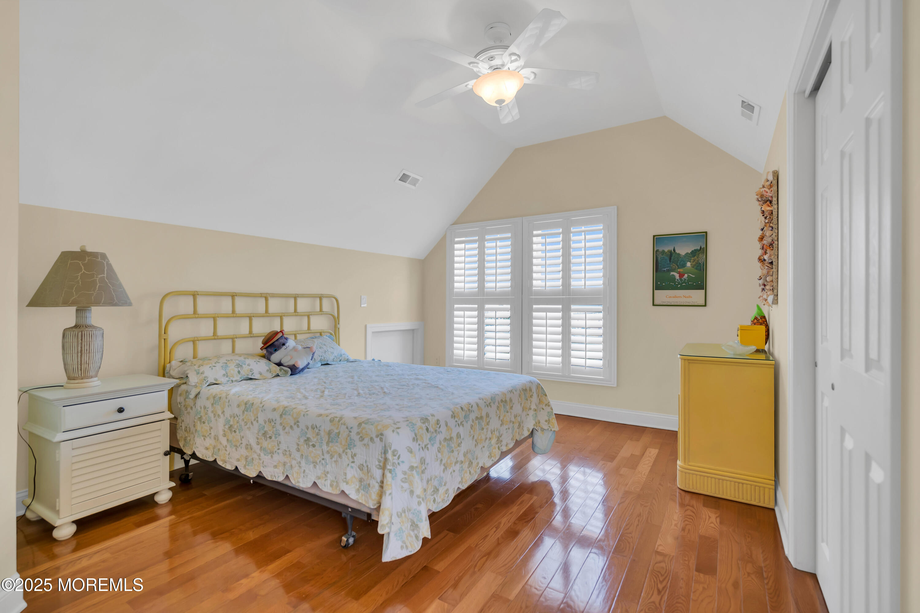 106 2nd Avenue Belmar, NJ 07719 - Photo 34 of 42 a bedroom with a bed and a dresser next to a window