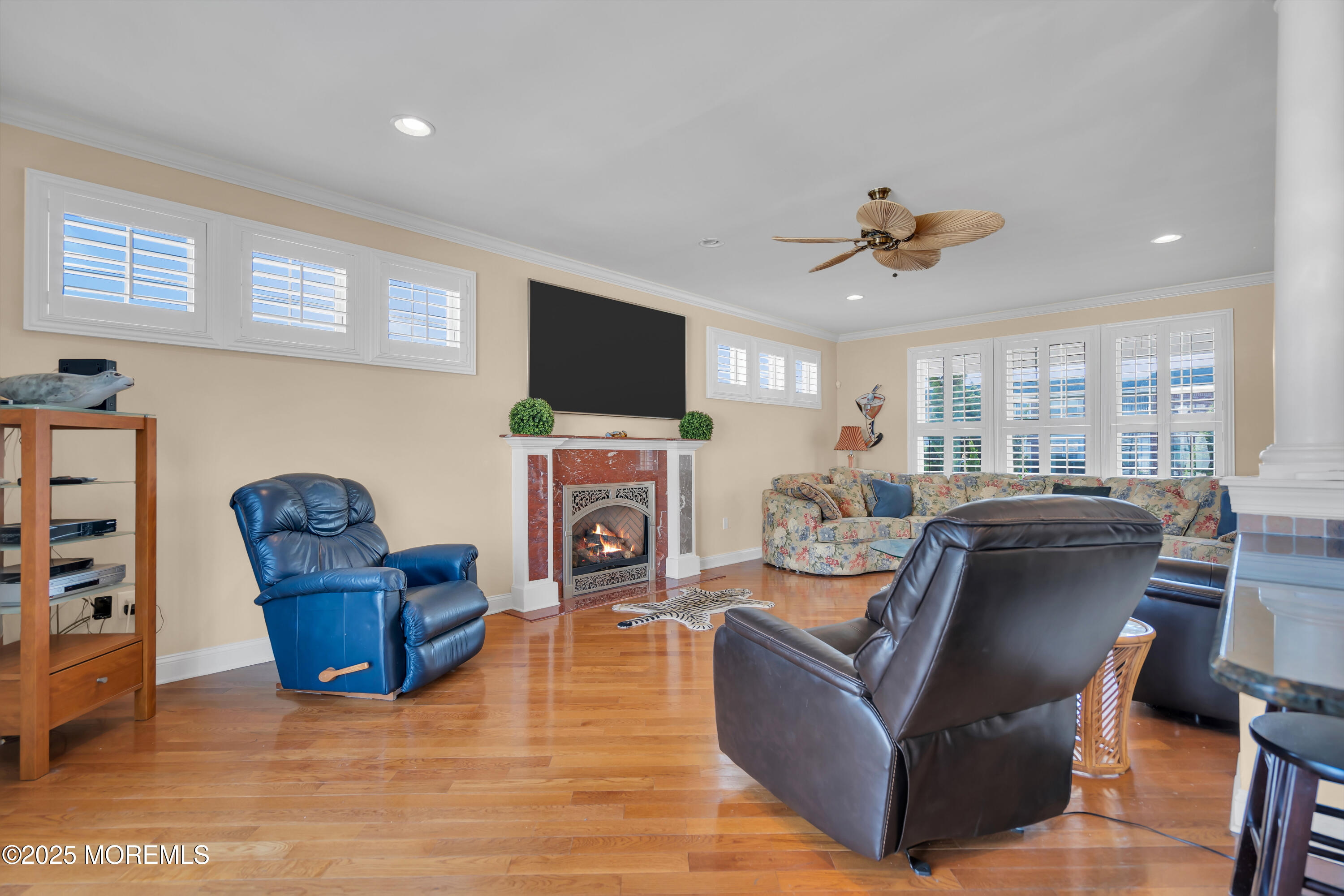 106 2nd Avenue Belmar, NJ 07719 - Photo 6 of 42 a living room with furniture a flat screen tv and a fireplace