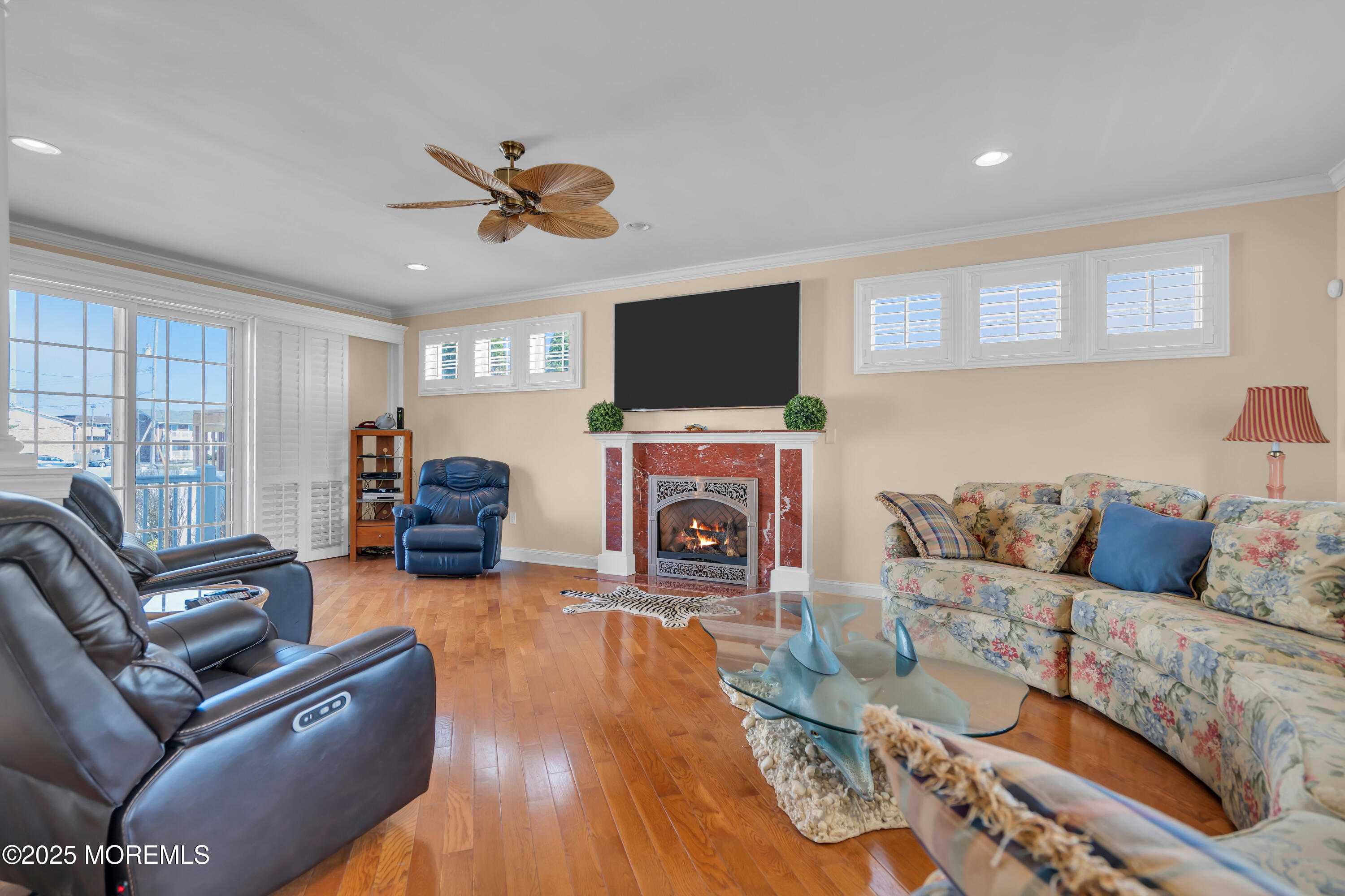 106 2nd Avenue Belmar, NJ 07719 - Photo 7 of 42 a living room with furniture a flat screen tv and a fireplace