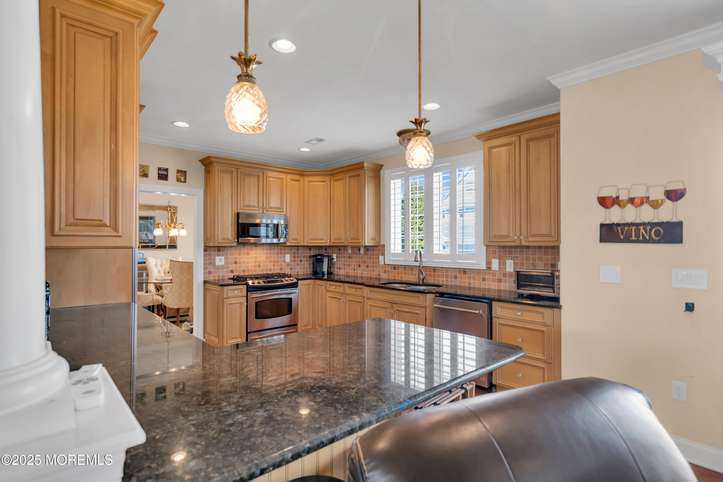 106 2nd Avenue Belmar, NJ 07719 - Photo 10 of 42 a kitchen with stainless steel appliances granite countertop a refrigerator a stove a sink and a microwave