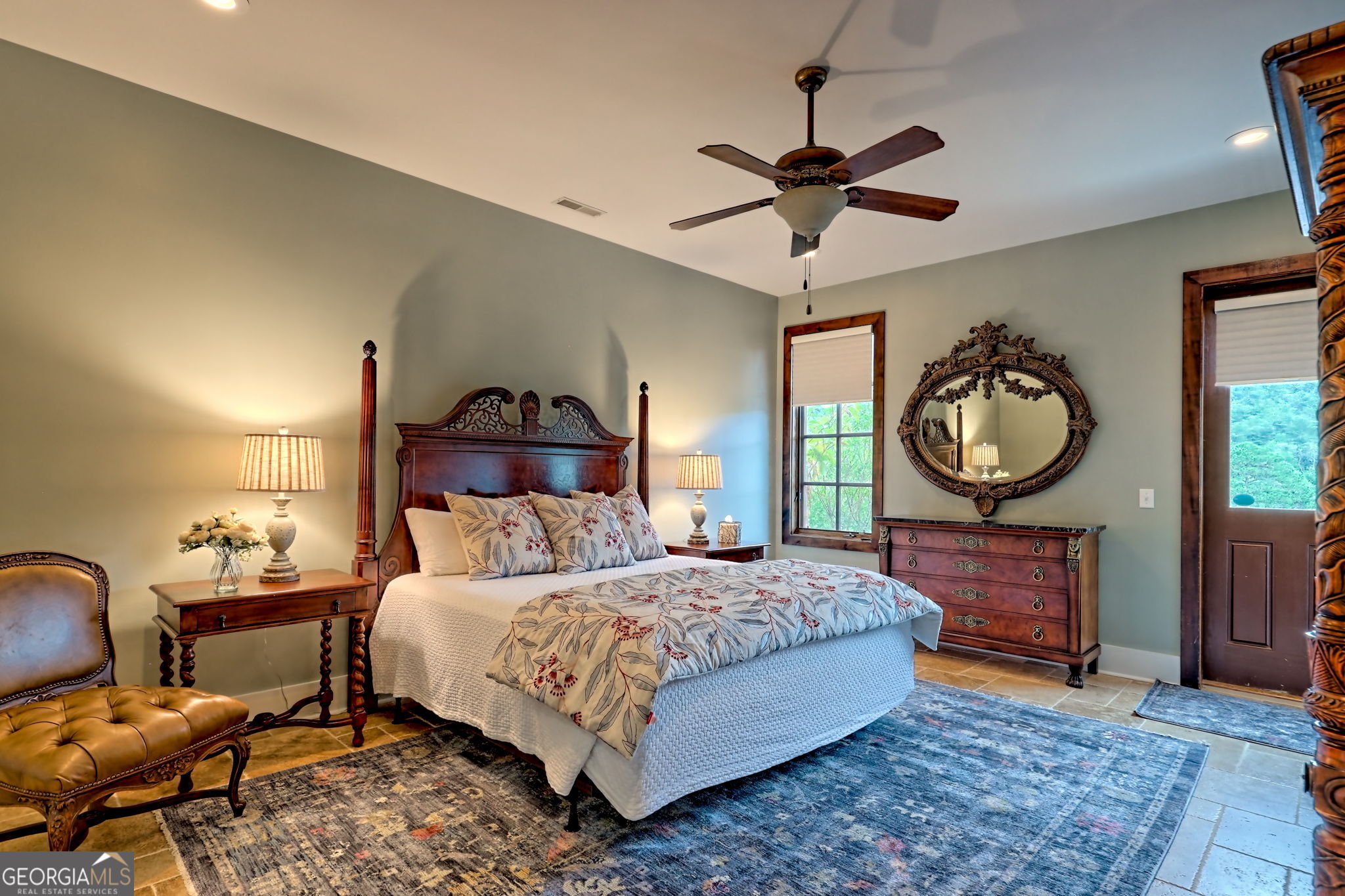3662 Blue Ridge Gap Road Clayton, GA 30525 - Photo 26 of 69 a bedroom with a bed a mirror on dresser and a chandelier