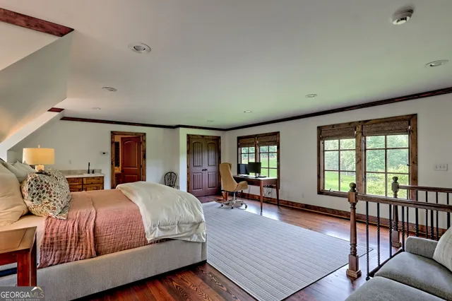 a view of a patio with chairs and wooden floor