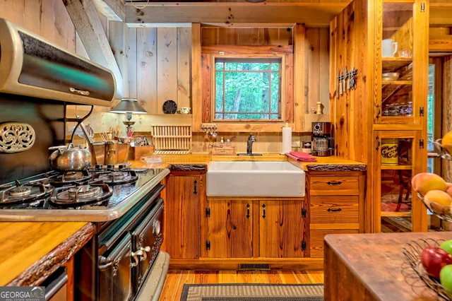 an aerial view of a house with swimming pool and sitting area