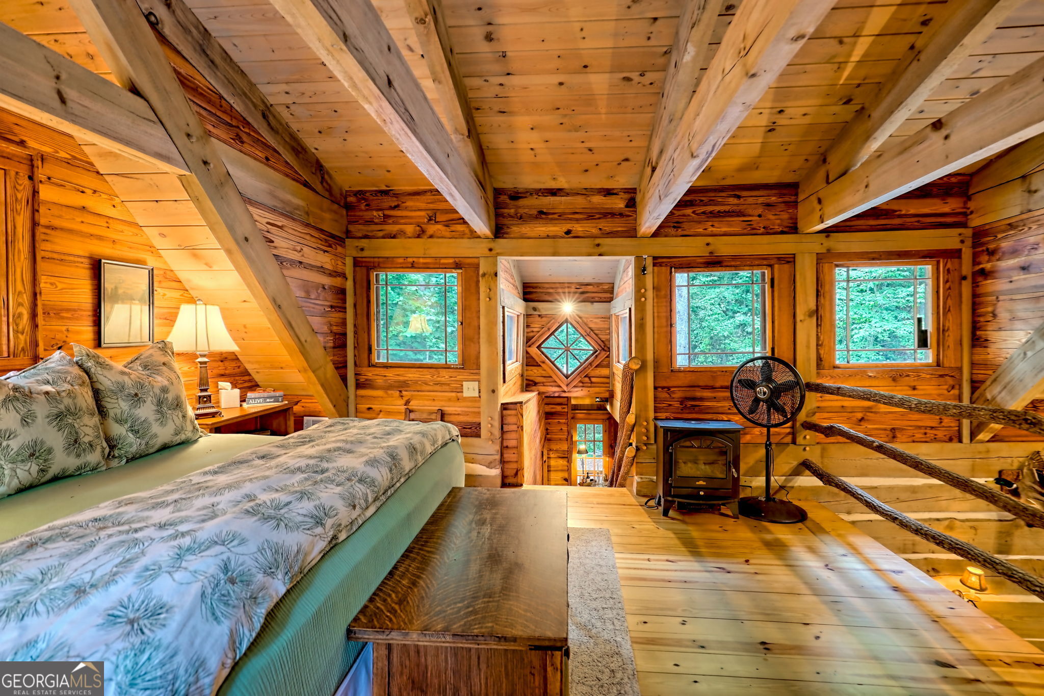 3662 Blue Ridge Gap Road Clayton, GA 30525 - Photo 40 of 69 a bedroom with a bed and large windows