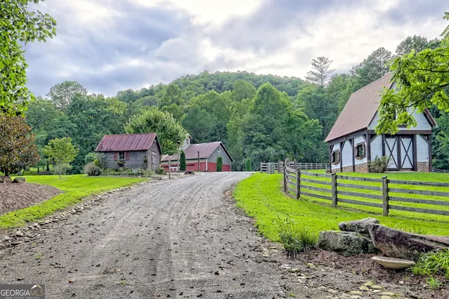 a front view of house with garage and green space