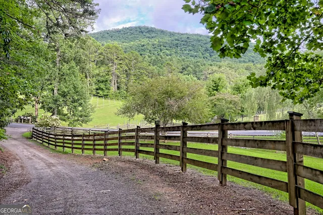 a view of a house with a porch and sitting area