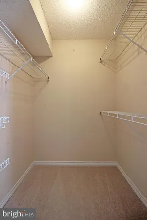 a view of a room with racks on the wall