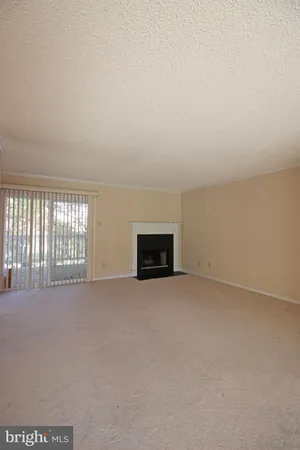 an empty room with a fireplace