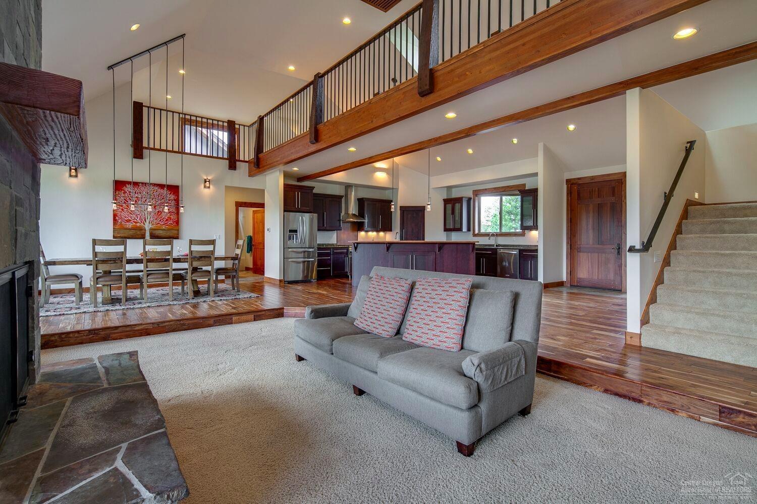 62855 Dickey Road Bend, OR 97701 - Photo 4 of 25 a living room with furniture and a fireplace