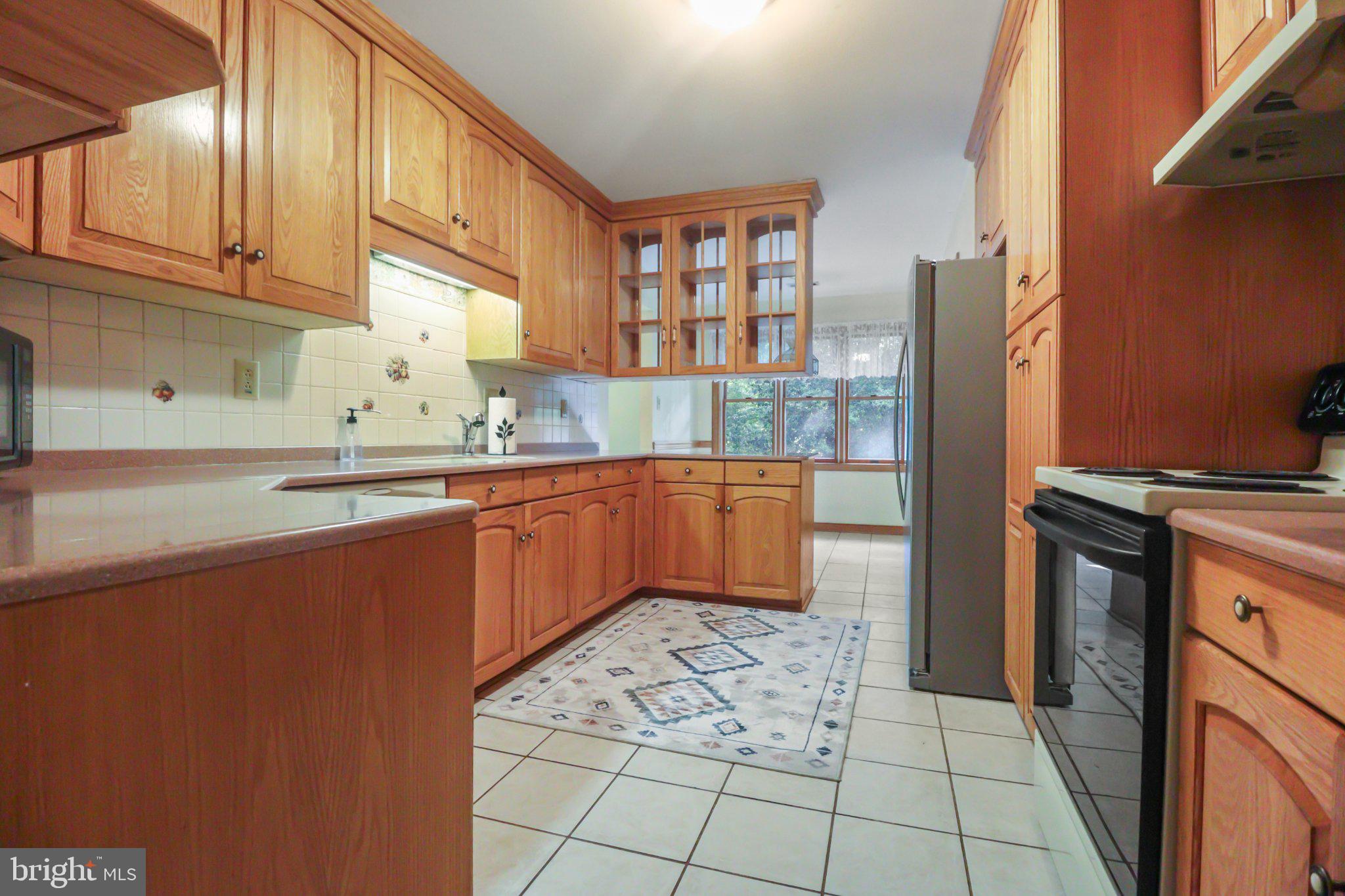 74 Cedar Road Pittsgrove, NJ 08318 - Photo 15 of 23 Warm wood tones in a spacious kitchen.