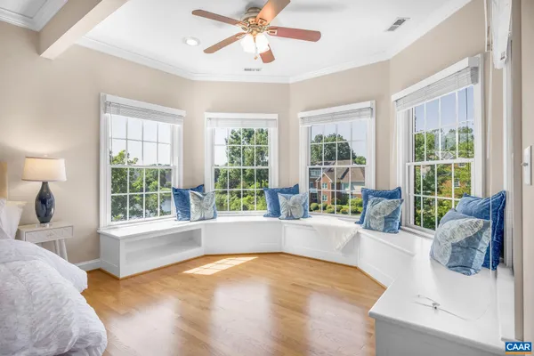 an empty room with windows and closet