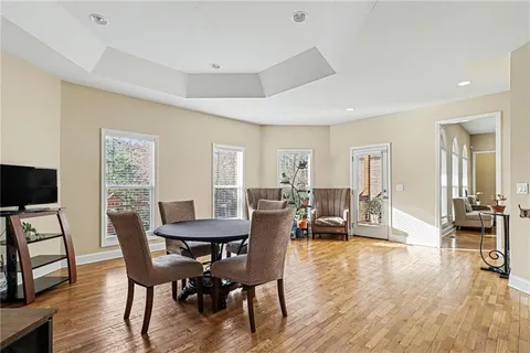 a view of a livingroom with furniture and a flat screen tv