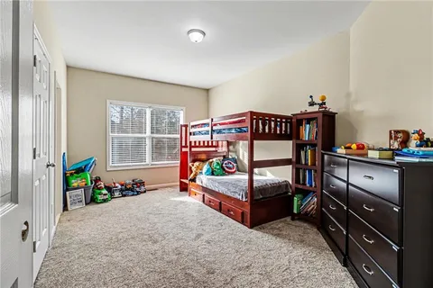 a bedroom with furniture and a window